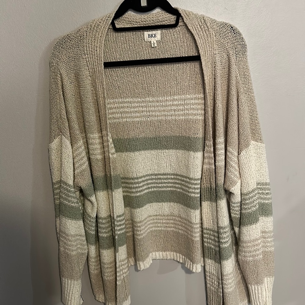 Buckle caridigan. Colors are tan, white with mint green. Size large